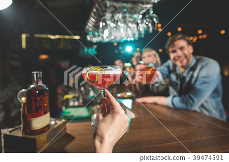 Female hand keeping delicious cocktail Female hand keeping delicious cocktail 39474591