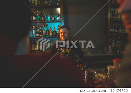 Happy barman enjoying his job Happy barman enjoying his job 39474753