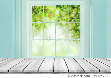 Empty wood table with blur window background. Empty wood table with blur window background. 39475227