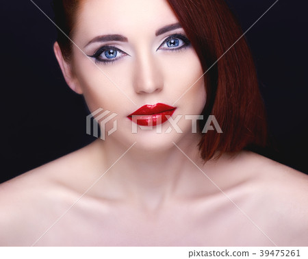 Gorgeous woman with long eyelashes and red lips.  39475261