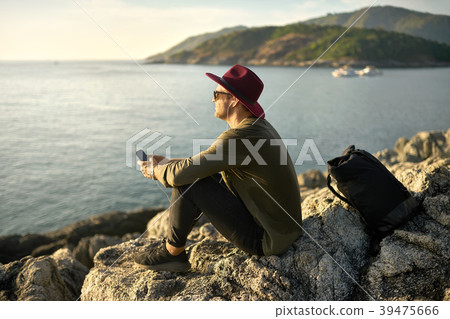 Traveler relaxing outdoors Traveler relaxing outdoors 39475666