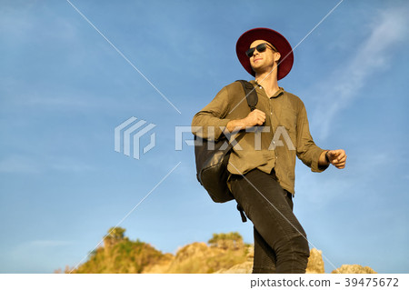 Traveler posing outdoors Traveler posing outdoors 39475672