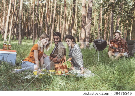 Happy people enjoying pastime at the picnic Happy people enjoying pastime at the picnic 39476549