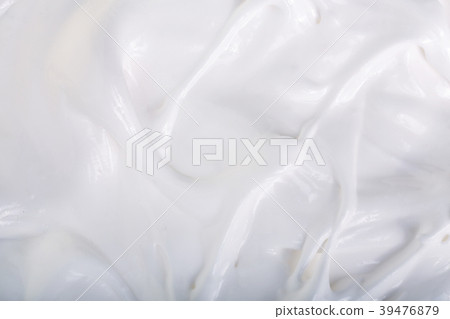 close up of a white whipped or sour cream on white 39476879