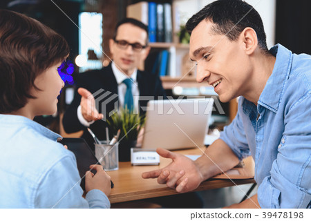 Realtor sitting at desk in office. Realtor sitting at desk in office. 39478198