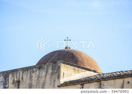 A view of the cross on the dome roof of the church A view of the cross on the dome roof of the church 39478993