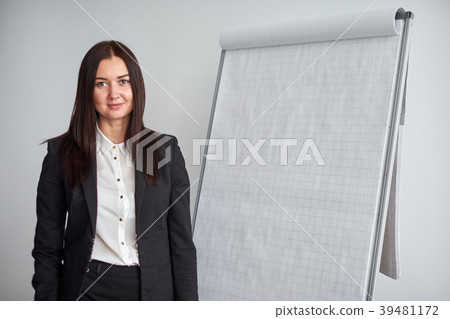 Portrait of young smiling businesswoman standing 39481172