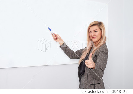 Portrait of young smiling businesswoman standing 39481263