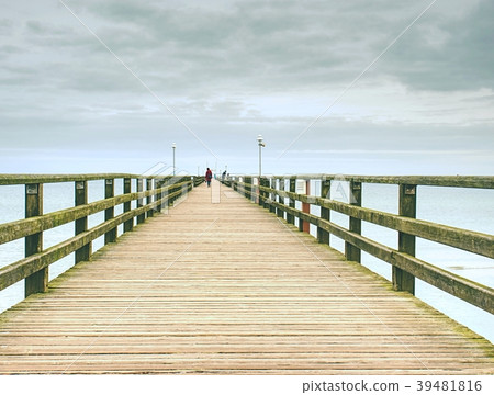 Wooden pier in holiday destination. Late summer Wooden pier in holiday destination. Late summer 39481816