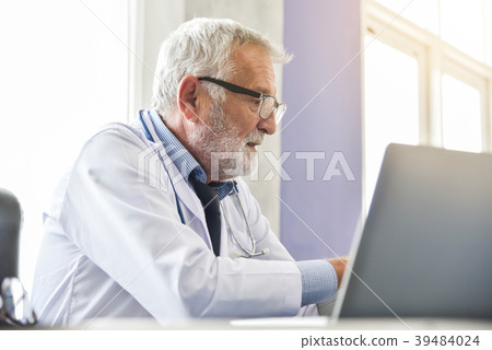 Senior male Doctor working. 39484024