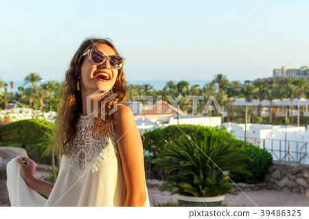 Close up portrait of a teenage girl in white dress Close up portrait of a teenage girl in white dress 39486325