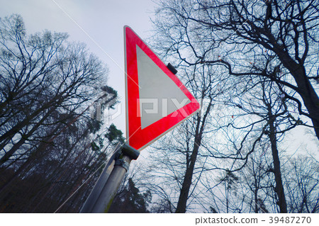 Traffic sign in front of bare trees 39487270