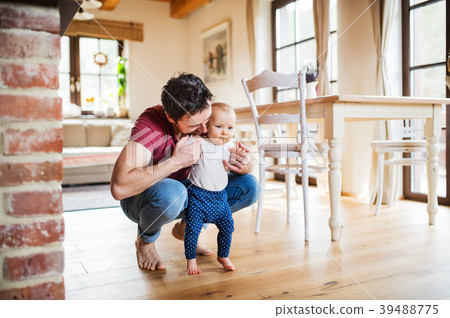 Father with a baby girl at home. Father with a baby girl at home. 39488775