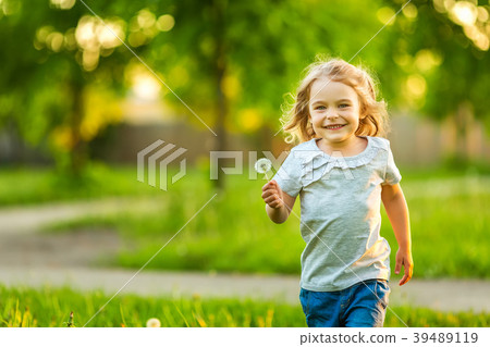 Little girl in spring sunny park Little girl in spring sunny park 39489119