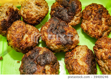 Home made beef meat balls on green plate Home made beef meat balls on green plate 39489246