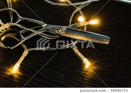 Professional hairdresser stylist scissors and a 39490753