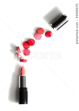 red sliced pieces between lipstick and cap red sliced pieces between lipstick and cap 39490870