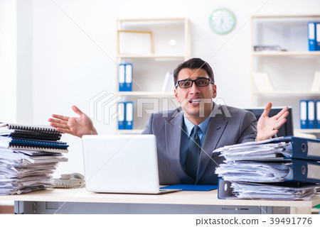 Overloaded with work employee under paperwork Overloaded with work employee under paperwork 39491776