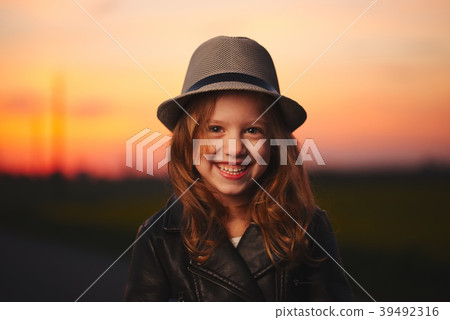 beautiful girl with hat on evening sunset 39492316
