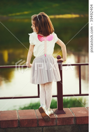 little girl with pink wings little girl with pink wings 39492404