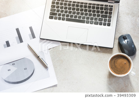 Open laptop, reports and cup. Top view. 39493309