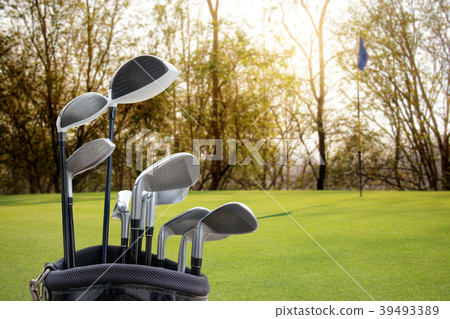 Golf equipment on green field background. Golf equipment on green field background. 39493389