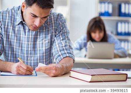 Students sitting and studying in classroom college Students sitting and studying in classroom college 39493615
