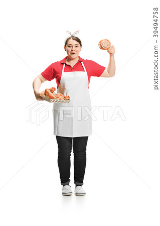 Portrait of cute smiling woman with pastries in 39494758