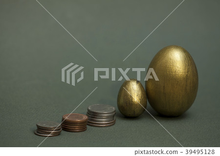 coins pile up and golden eggs 39495128