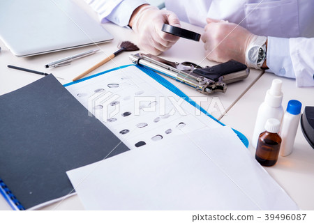 Criminologist police chemist looking at crime Criminologist police chemist looking at crime 39496087
