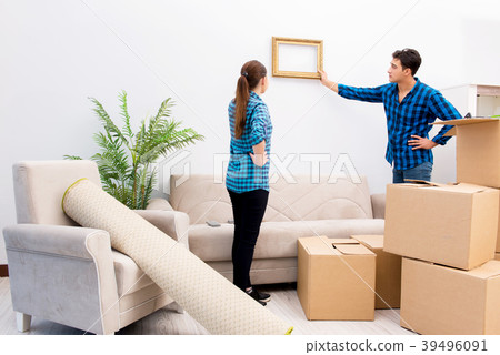 Young family relocating to new house apartment Young family relocating to new house apartment 39496091