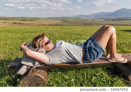 Woman resting on summer hill 39497450