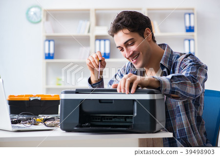 Hardware repairman repairing broken printer fax 39498903