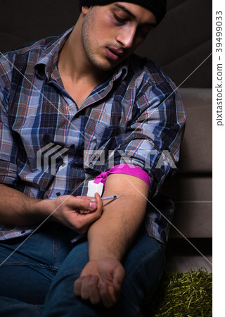 Young man in agony having problems with narcotics  39499033