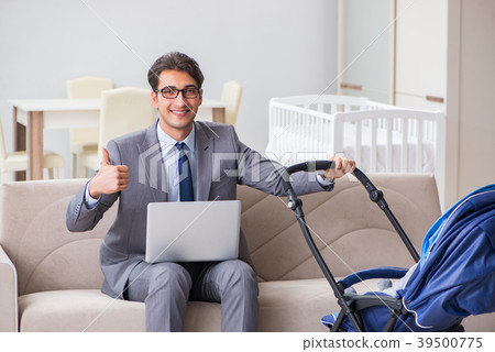 Businessman looking after newborn baby at home and Businessman looking after newborn baby at home and 39500775
