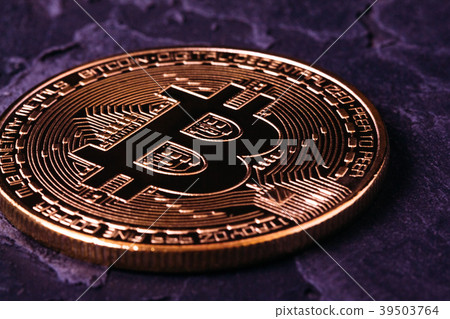 Bitcoin crypto-gold on a dark background close-up 39503764