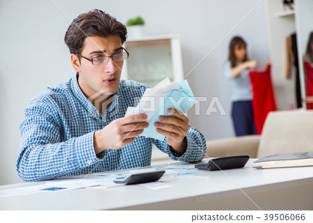 Young couple looking at family finance papers Young couple looking at family finance papers 39506066