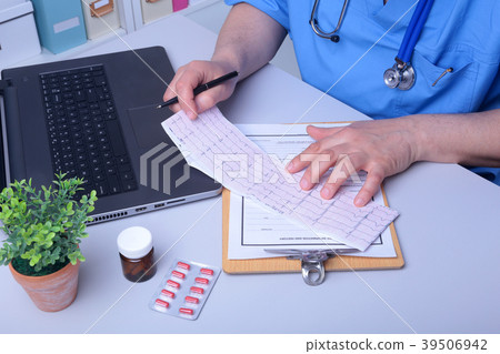 Close-up of doctor's hands writing prescription Close-up of doctor's hands writing prescription 39506942