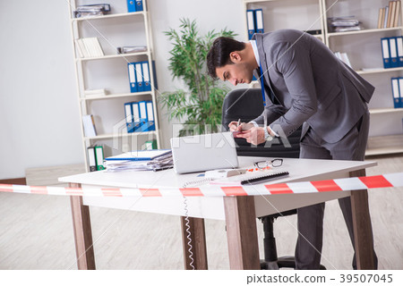 Forensics investigator at the scene of office Forensics investigator at the scene of office 39507045