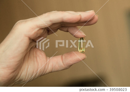 Hand of an elderly woman with pills Hand of an elderly woman with pills 39508023