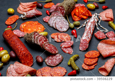 Various types of sausage on dark concrete 39508229
