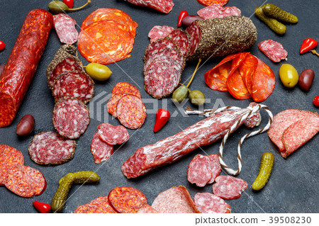 Various types of sausage on dark concrete Various types of sausage on dark concrete 39508230