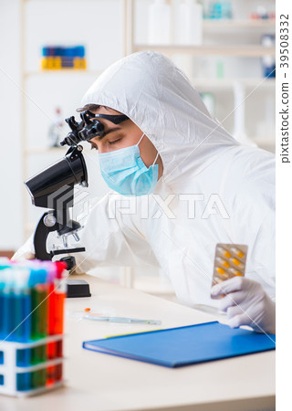 Drug synthesis concept with chemist working in Drug synthesis concept with chemist working in 39508332