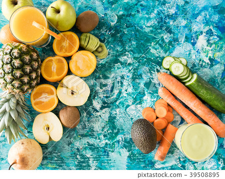 Glasses with detox juice next to fruits and Glasses with detox juice next to fruits and 39508895