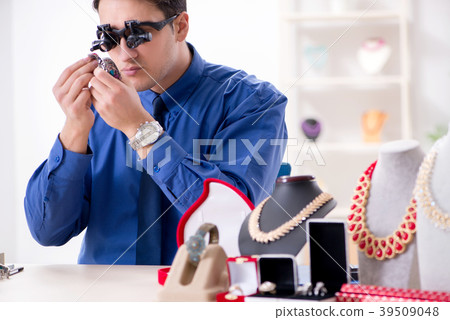 Jeweler working with luxury jewelry in the 39509048