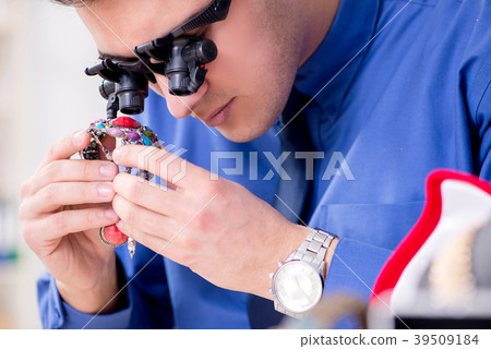 Jeweler working with luxury jewelry in the 39509184