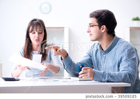 Young couple looking at family finance papers Young couple looking at family finance papers 39509185