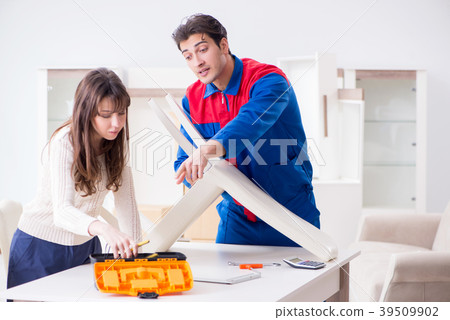 Contractor repairman assembling furniture under 39509902