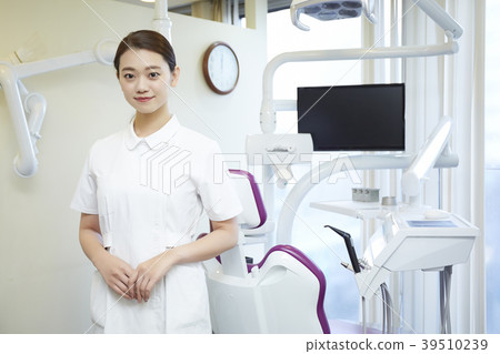 Woman working at dentist Woman working at dentist 39510239