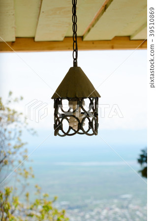 Forged metal a plafond on a chain 39510869